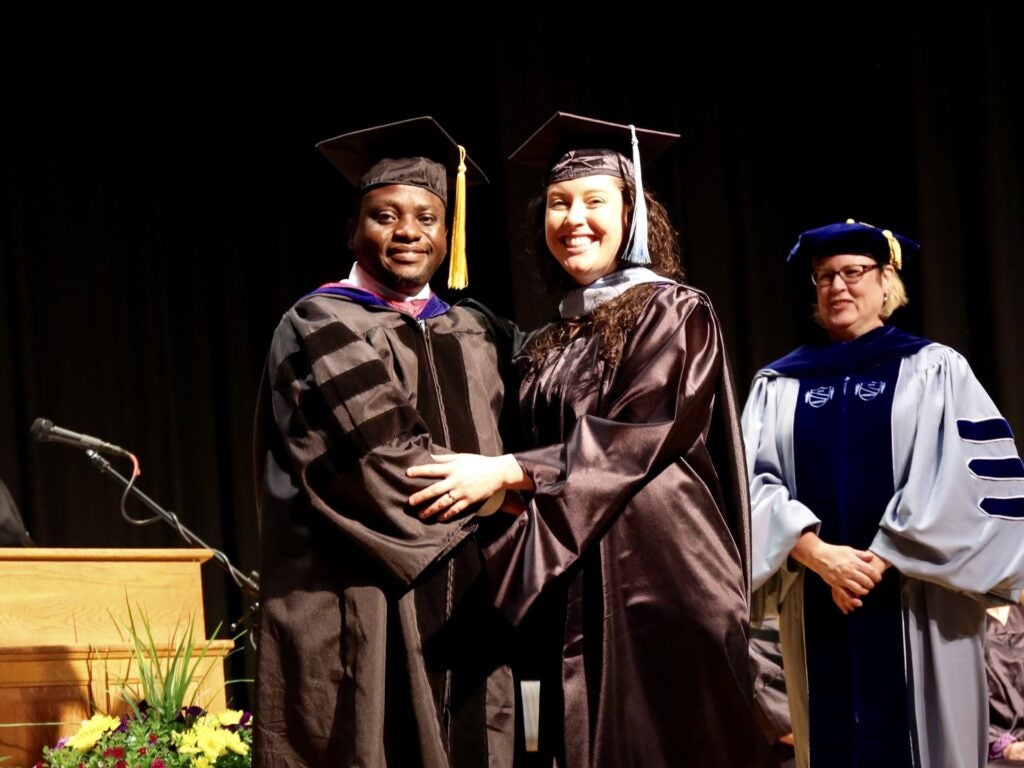 High school math teachers from Eastern North Carolina graduate from ECU with their masters degrees in education.