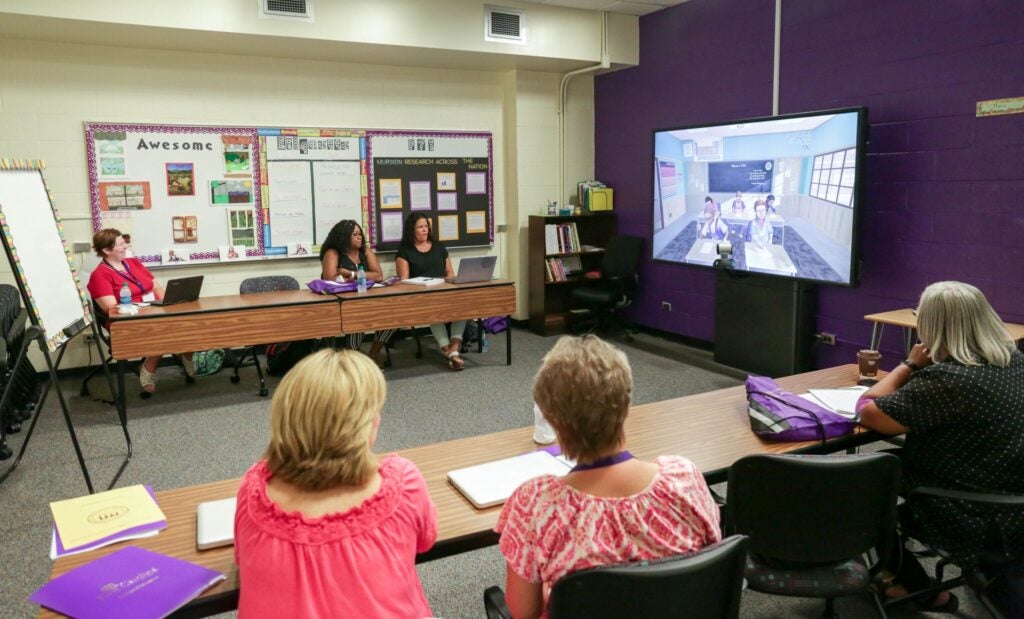 Representatives from eastern North Carolina school districts observe Mursion at work on Thursday, July 27. 
