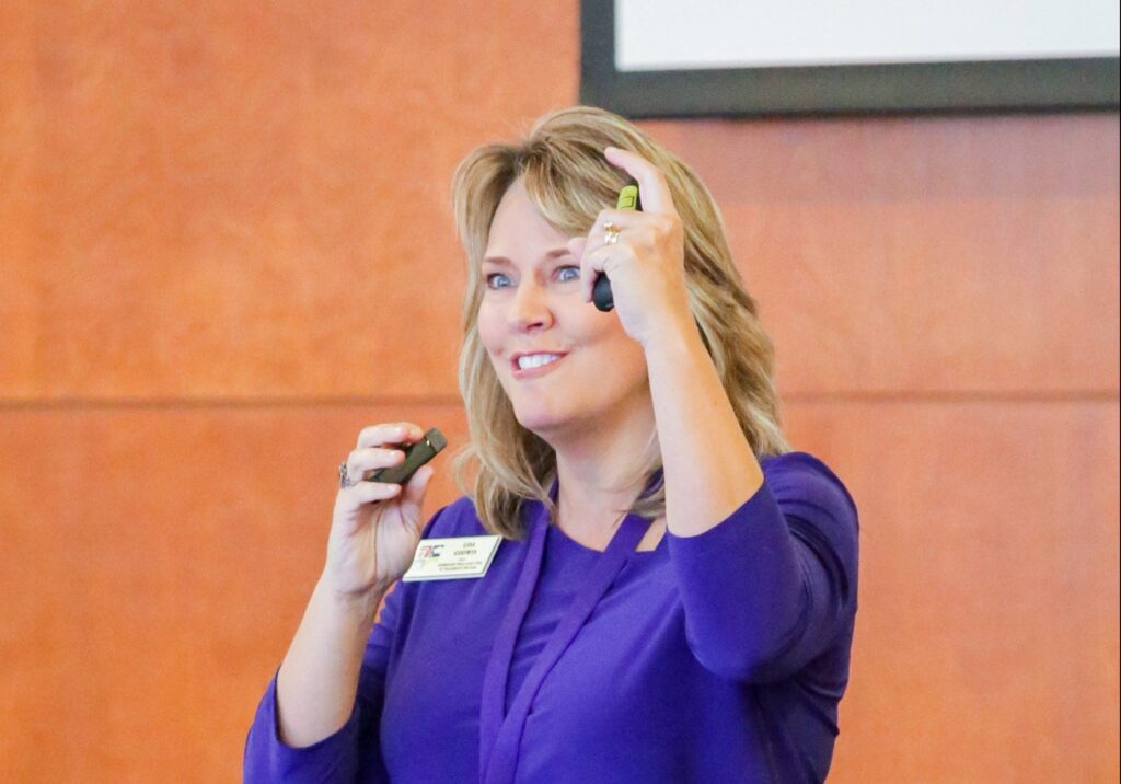 NC Teacher of the Year Lisa Godwin flashes a Pirate hook at the ECU Murphy Center Monday, Oct. 30.