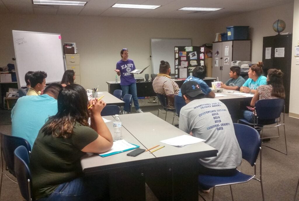 ECU Counselor Education faculty and students collaborating with the Association of Mexicans in North Carolina (AMEXCAN) in Greenville to provide education about college readiness to the community. 