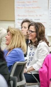 A participant in the ECU College of Education Department of Educational Leadership's equity summit listens to keynote speaker Thomas Murray. 