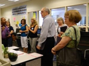 Alan R. Bailey showing Library Science alumni the Teaching Resource Center