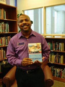 Alan R. Bailey with his newly published book, Building a Core Print Collection for Preschoolers 