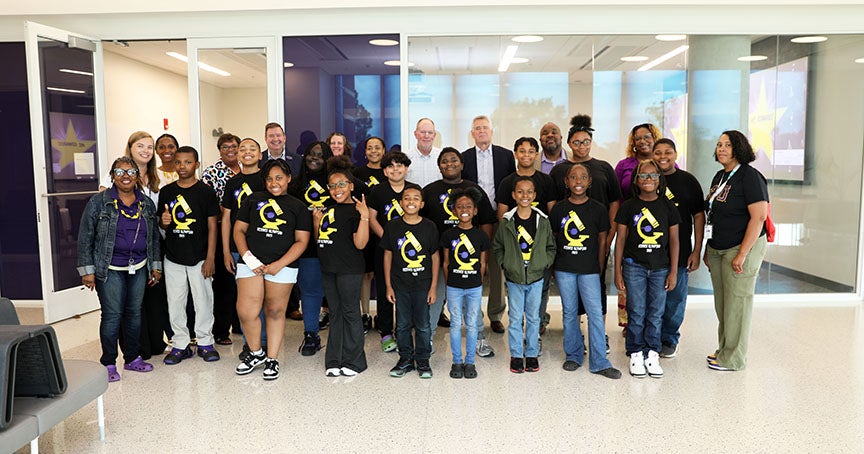 3-5th graders gathered for photo with teachers and administrators