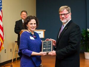 Faulconer accepts the Howard Best award from Landis Bullock