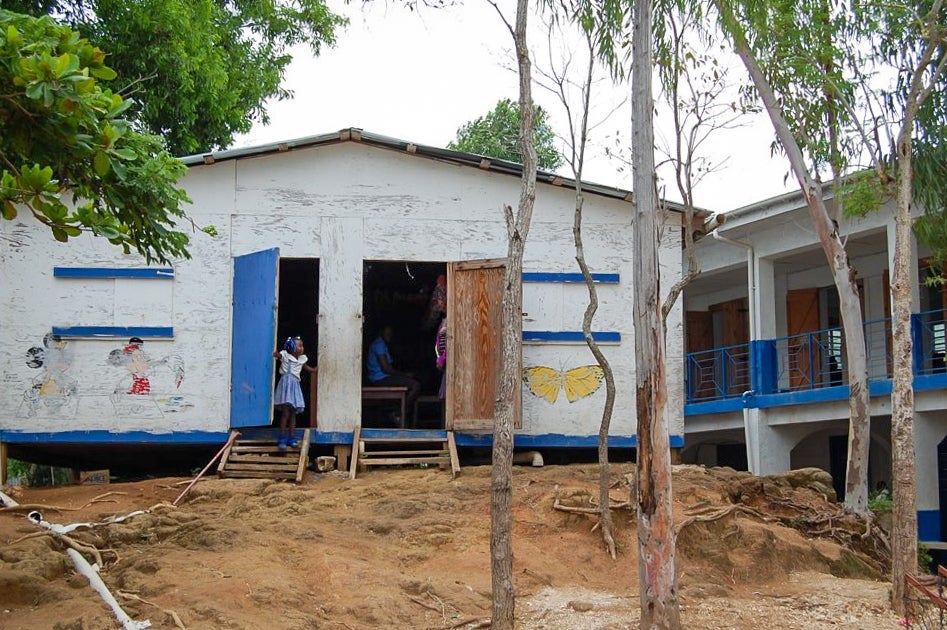 A student leans outside of Saint Antoine School in the Fondwa Mountains of Haiti. 