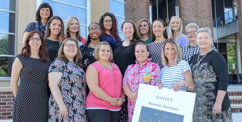 The inaugural class of 12 CONVEY scholars and the leadership team during the program’s summer institute at the ECU Health Sciences Student Center.