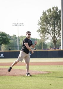 Isaiah Ybarra, a history education major and member of SVRA, throws out the first pitch before the ECU Baseball game on Friday, May 11. 