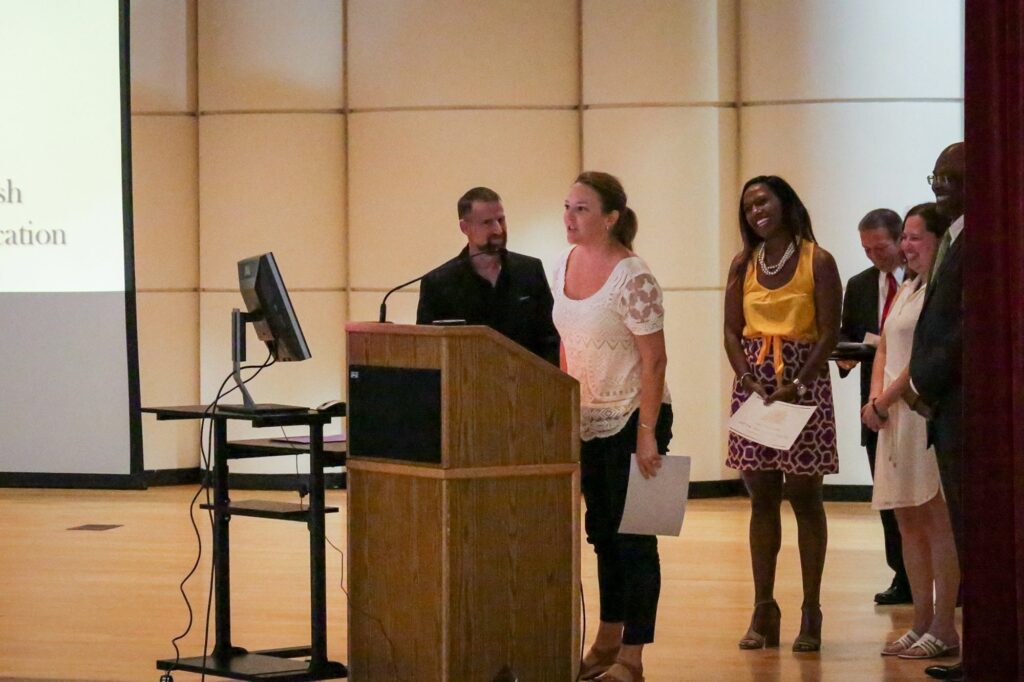 Dr. Anne Ticknor accepts her Profiles in Diversity award at the ECU College of Education Convocation Friday, Aug. 18. 